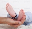 depositphotos_11701691-Baby-feet-held-in-mothers-hand.jpg