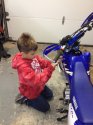 Vince working on bike.JPG